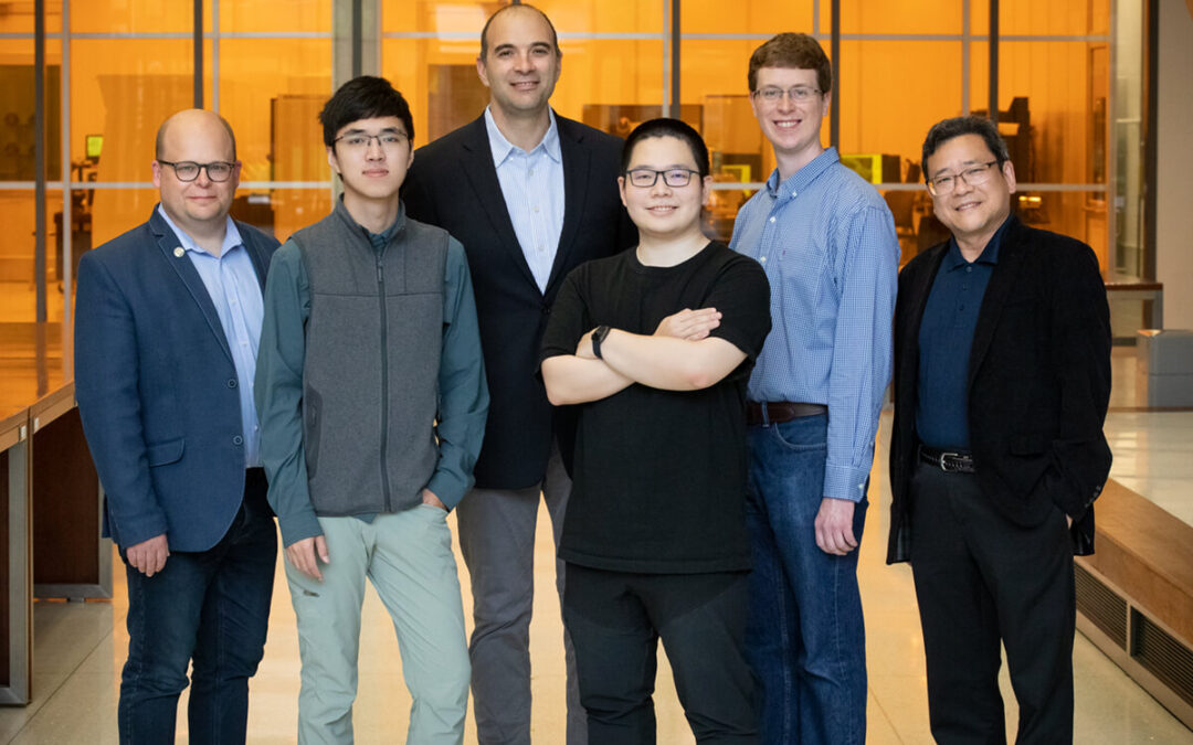 Wawrzyniec Dobrucki, left, Zhongmin Zhu, Viktor Gruev, Zuodong Liang, Steven Blair and Shuming Nie collaborated to develop an imaging system that replicates the vision of mantis shrimp and could help surgeons achieve cleaner margins during cancer-removal procedures.