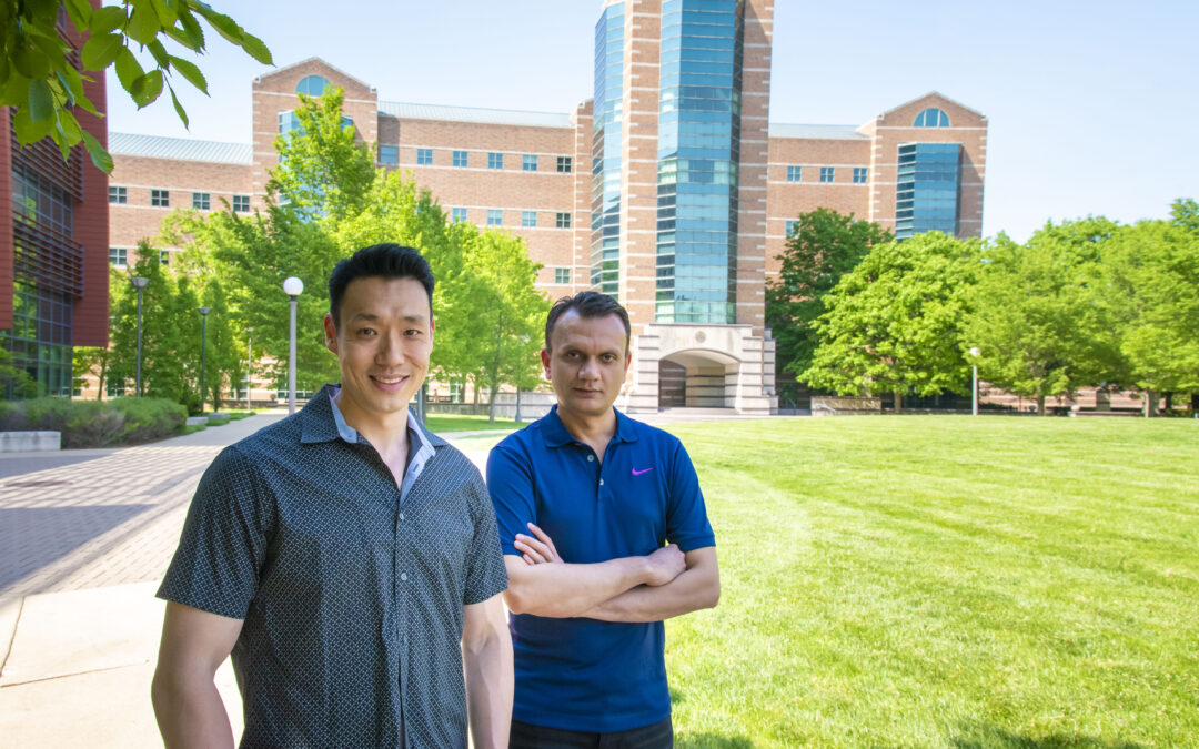 Image of Jeff Chan and Anuj Yadav standing in front of Beckman Institute